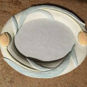 OVAL SHAPED FHEAVY PICTURE RAME WITH FLOWERS 9" X 7 1/2"